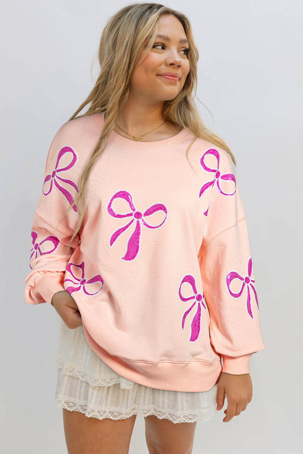 Glitz & Grace Sweatshirt – Apricot Pink Sequin Bow Oversized Pullover